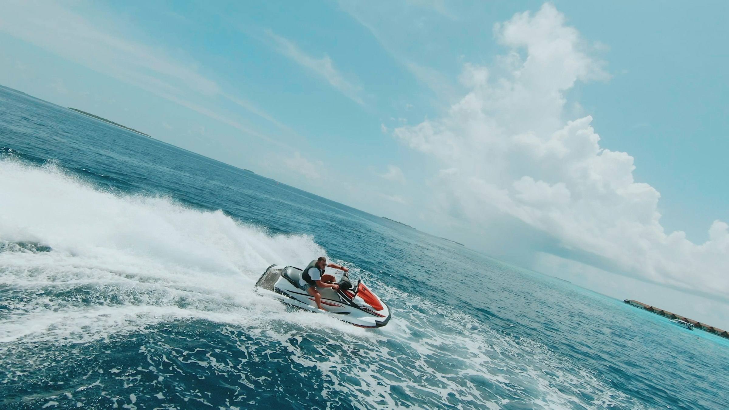 Jet ski cutting across turquoise water